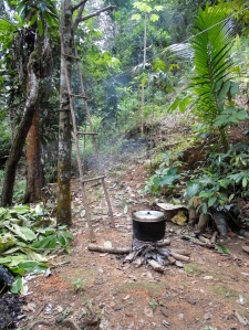 Cooking ketuput in the jungle at 'Bung's' house