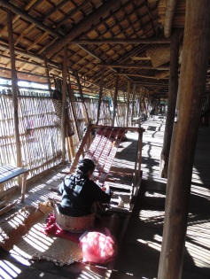 Early morning weaving. Ensaid Panjang Longhouse, Sintang, West Kalimantan