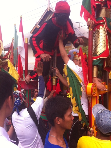 This man is leaning his weight onto a blade Cap Go Meh Festival, Singkawang, West Kalimantan