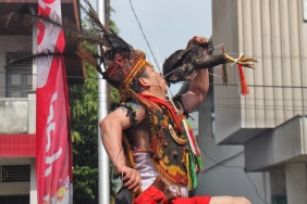 Eating the head of a chicken Cap Go Meh Festival, Singkawang, West Kalimantan Photo courtesy of Ted Chang